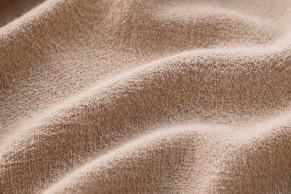 Close-up of ATHAR linen-cotton fabric texture by QADIM