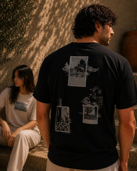 QADIM Naqsh graphic tee, editorial lifestyle photo in black and beige