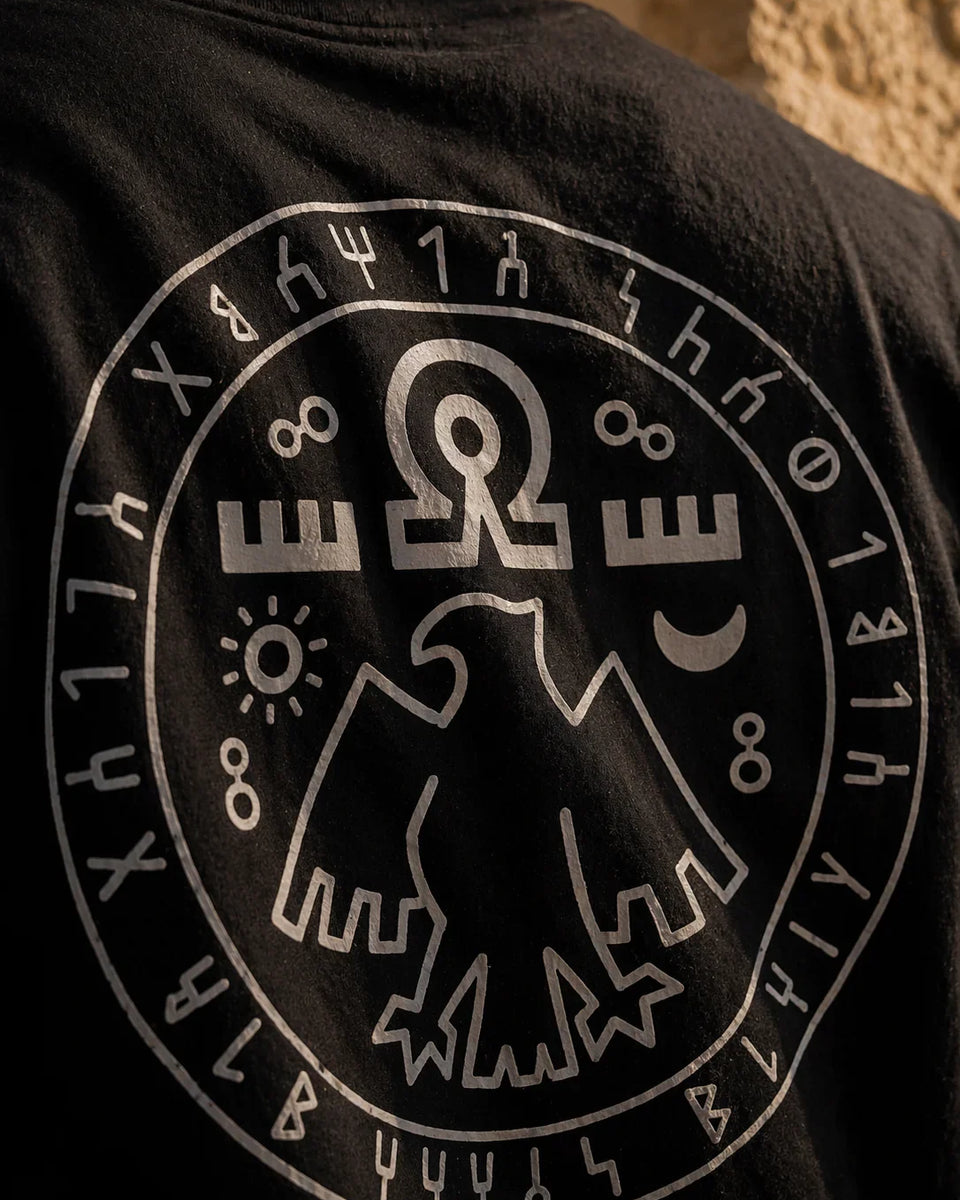 Black t-shirt with white logo and symbols on the back