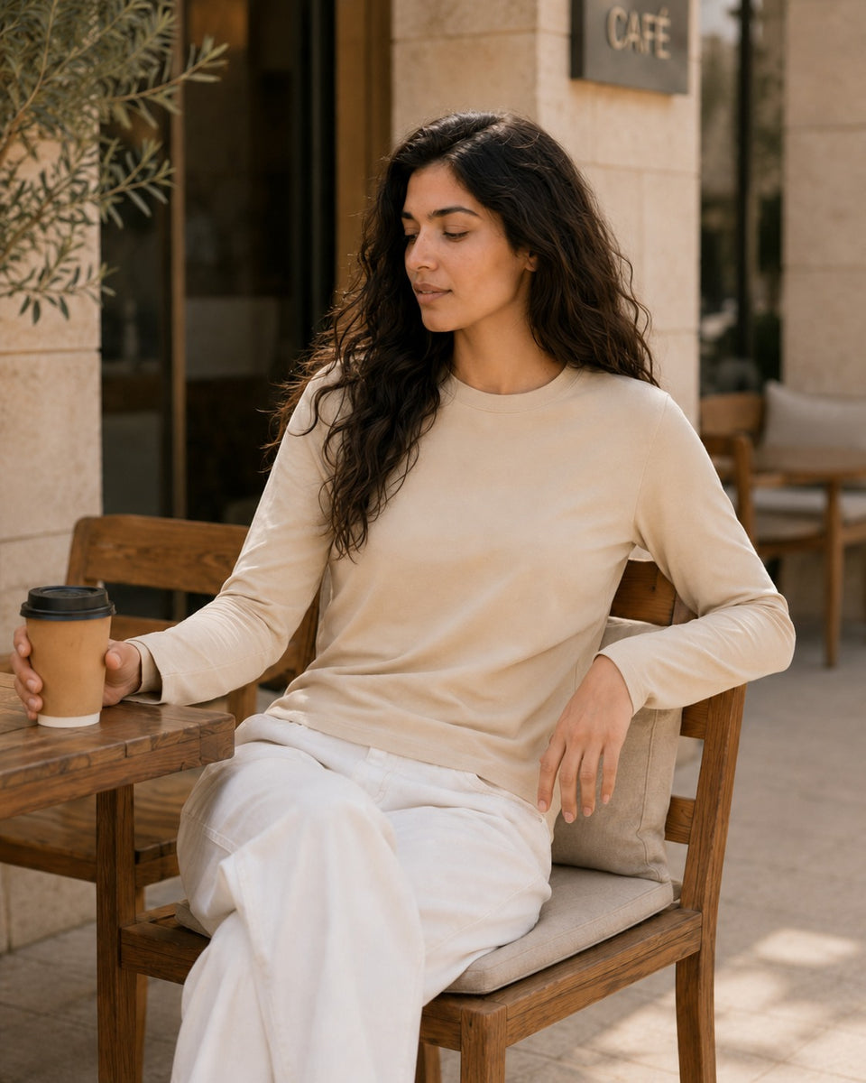 QADIM washed beige long sleeve tee front view, relaxed fit
