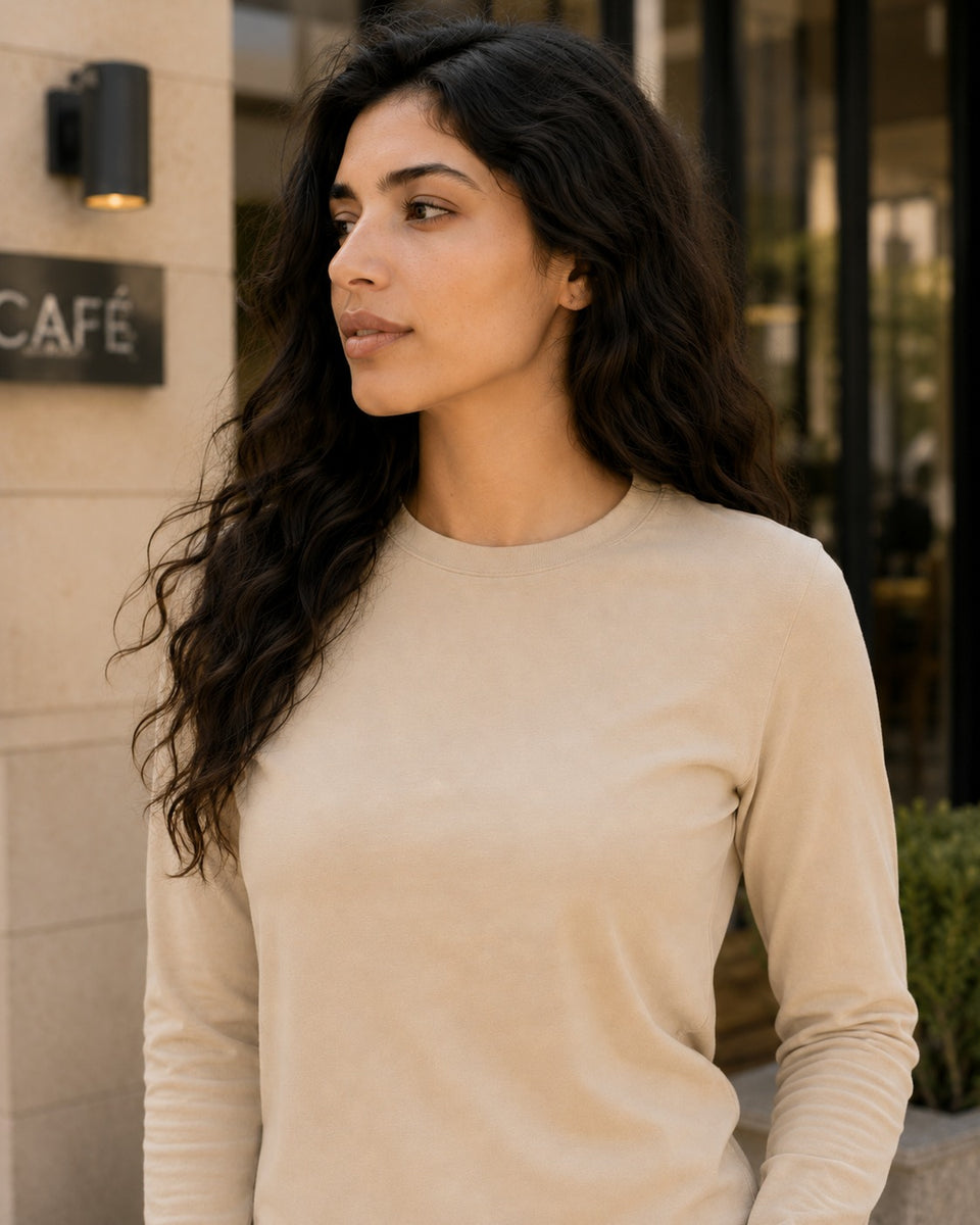Close-up of QADIM washed beige long sleeve tee neckline and washed fabric