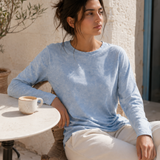 QADIM washed baby blue long sleeve tee, outdoor cafe editorial, full look