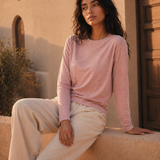 QADIM washed pink long sleeve tee, golden-hour editorial, relaxed modest fit