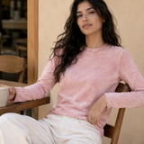 QADIM washed pink long sleeve tee styled at a cafe in warm tones
