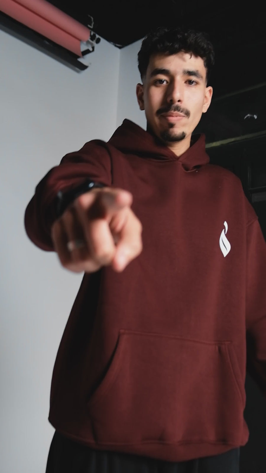 QADIM Sahm relaxed hoodie in burgundy, front and arrow back print, in motion | هودي سهم ريلاكس نبيتي في فيديو