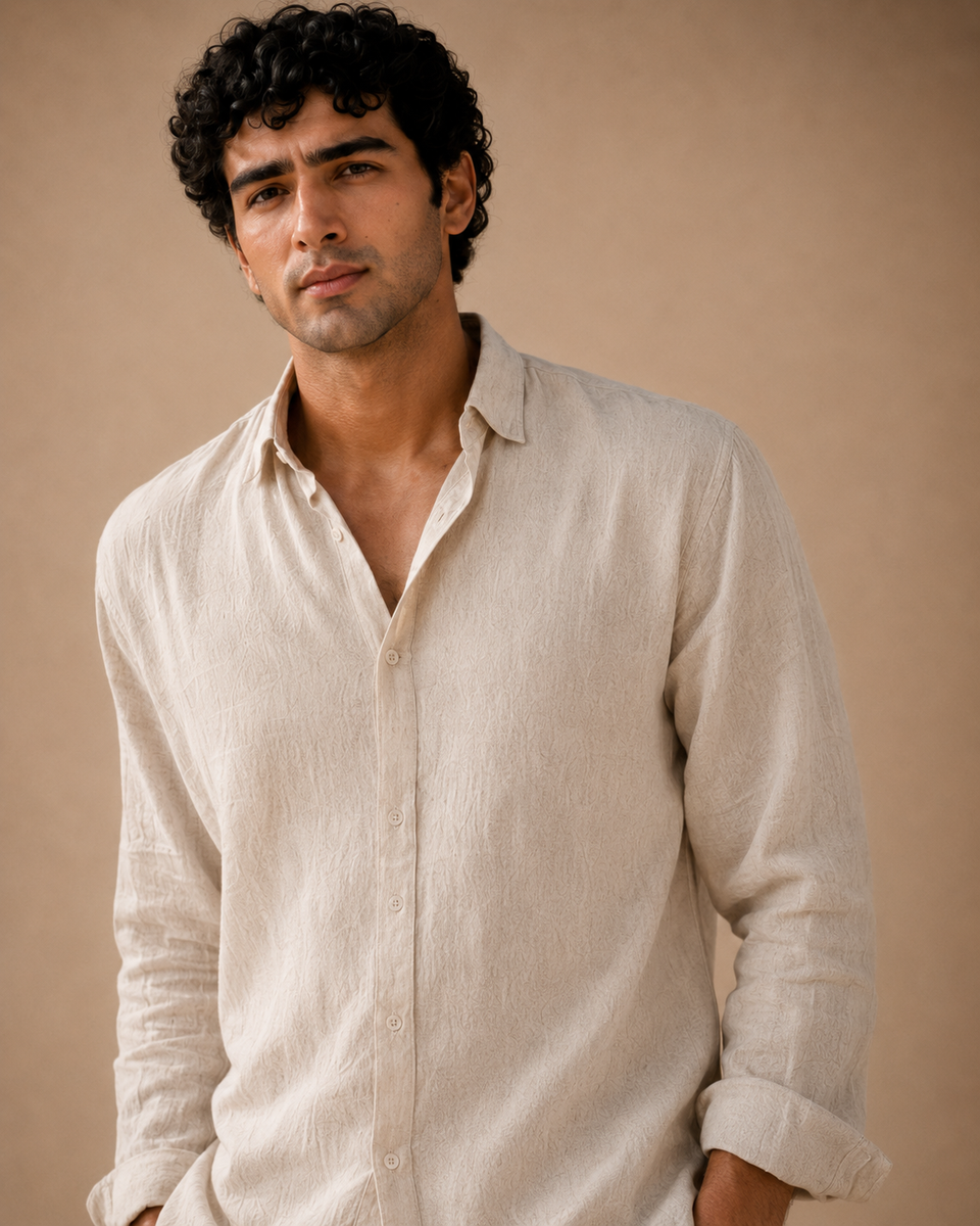 Man wearing ATHAR Linen Relaxed Fit shirt in Beige, portrait | رجل يرتدي قميص أثر الكتان الفضفاض بلون بيج