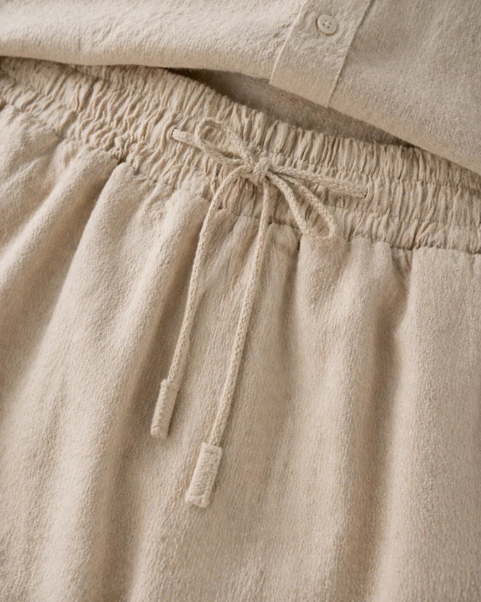 Beige linen pants with a drawstring waistband