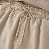 Beige linen pants with a drawstring waistband
