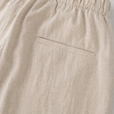 Beige pants with an elastic waistband on a light gray background