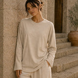 Beige long sleeve tee front view with relaxed oversized fit and soft fabric drape