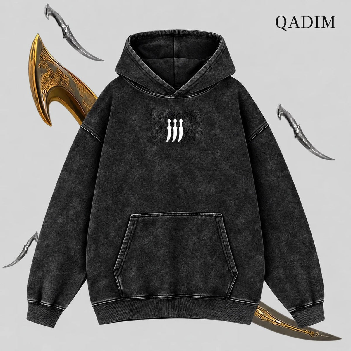 QADIM Jambiya washed hoodie in black, front with small jambiya chest emblem | هودي جنبية مغسول أسود من قدّام