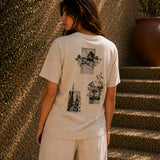 QADIM Naqsh beige half sleeve tee back artwork worn by female model beside stone stairs