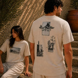 QADIM Naqsh beige half sleeve tee back artwork worn by male and female model in sunlit editorial setting