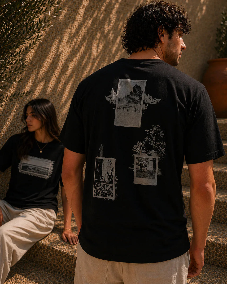 QADIM Naqsh black half sleeve tee back artwork worn by male and female model in editorial setting