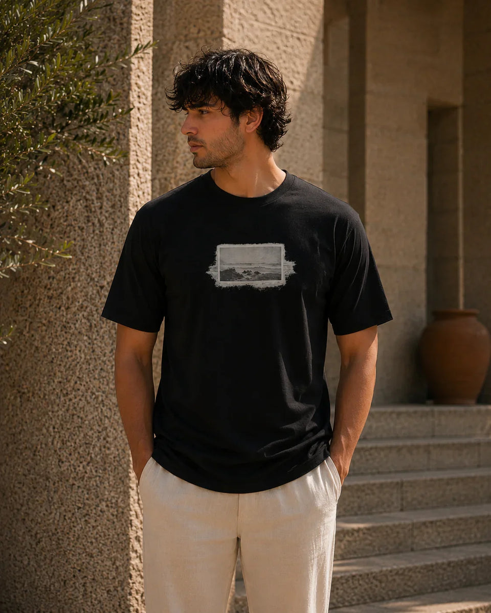 QADIM Naqsh black half sleeve tee front graphic worn by male model