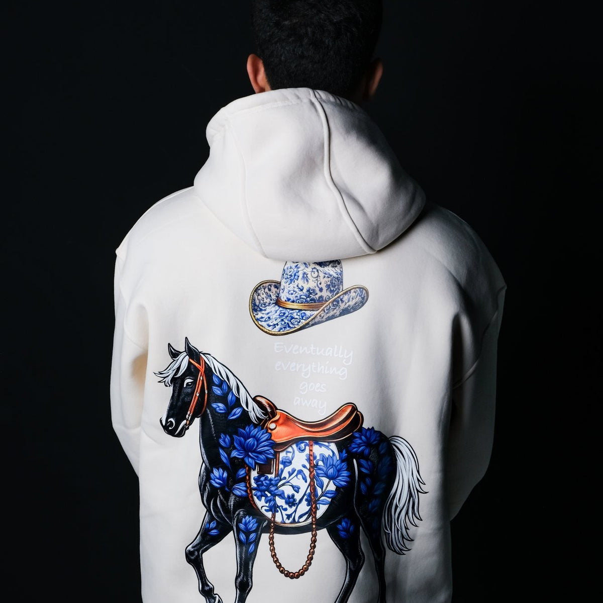 Real photo: QADIM Safar relaxed hoodie in beige, horse and hat back print | صورة حقيقية: ضهر هودي سفر البيج
