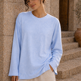 Washed baby blue long sleeve tee front view with loose sleeves and side slit