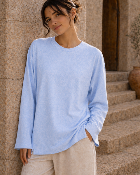 Washed baby blue long sleeve tee front view with loose sleeves and side slit