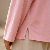 Close-up of the pink Washed Long Sleeve Tee side slit showing washed texture and soft fabric detail
