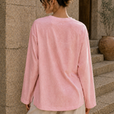Washed pink long sleeve tee back view with relaxed fit and side slits