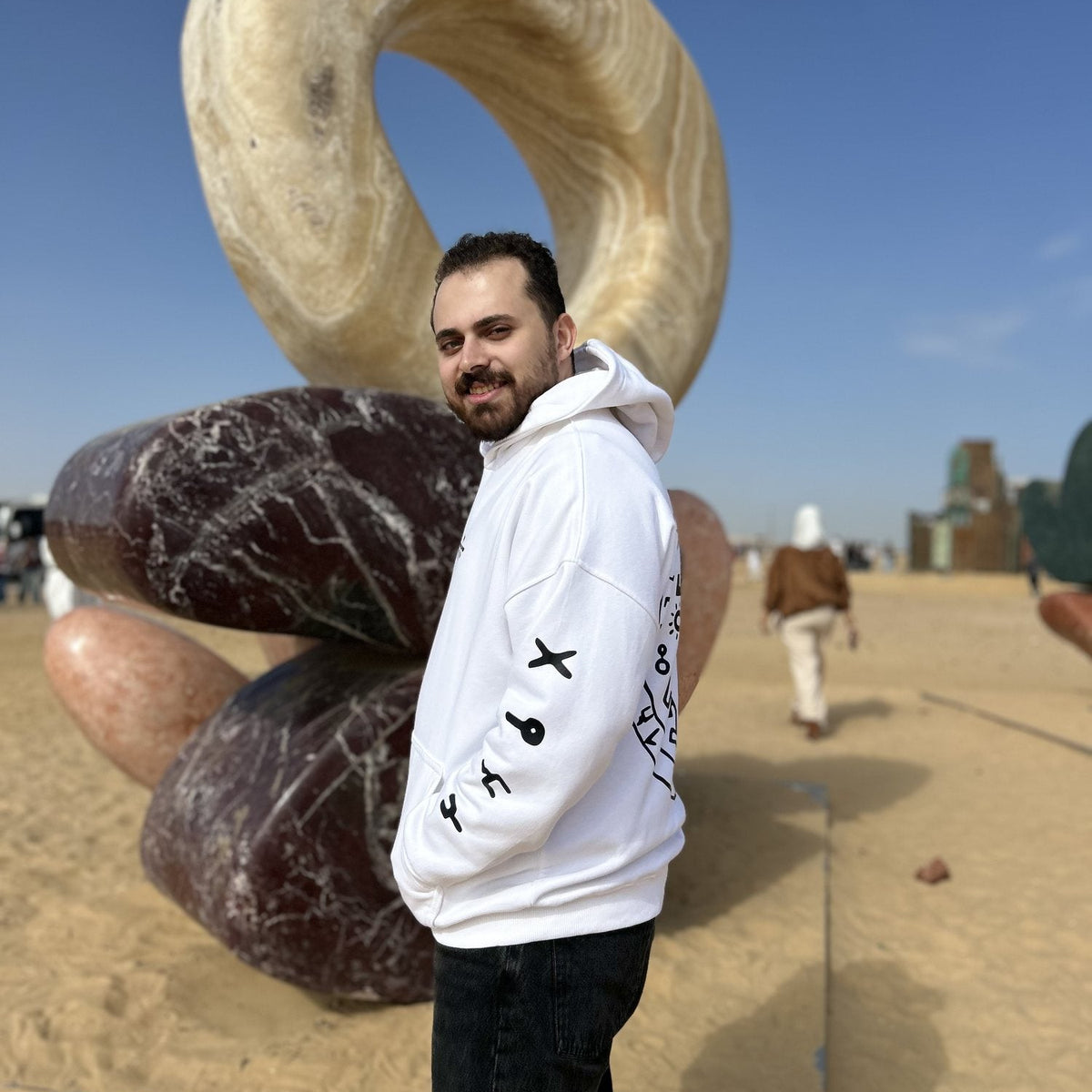 QADIM 7 Eagles relaxed hoodie in white, sleeve symbols, side view | هودي ٧ نسور ريلاكس أبيض من الجنب