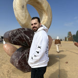 QADIM 7 Eagles relaxed hoodie in white, sleeve symbols, side view | هودي ٧ نسور ريلاكس أبيض من الجنب