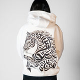 QADIM Asil relaxed hoodie in white, calligraphy horse back print, female model | ضهر هودي الأصيل الأبيض