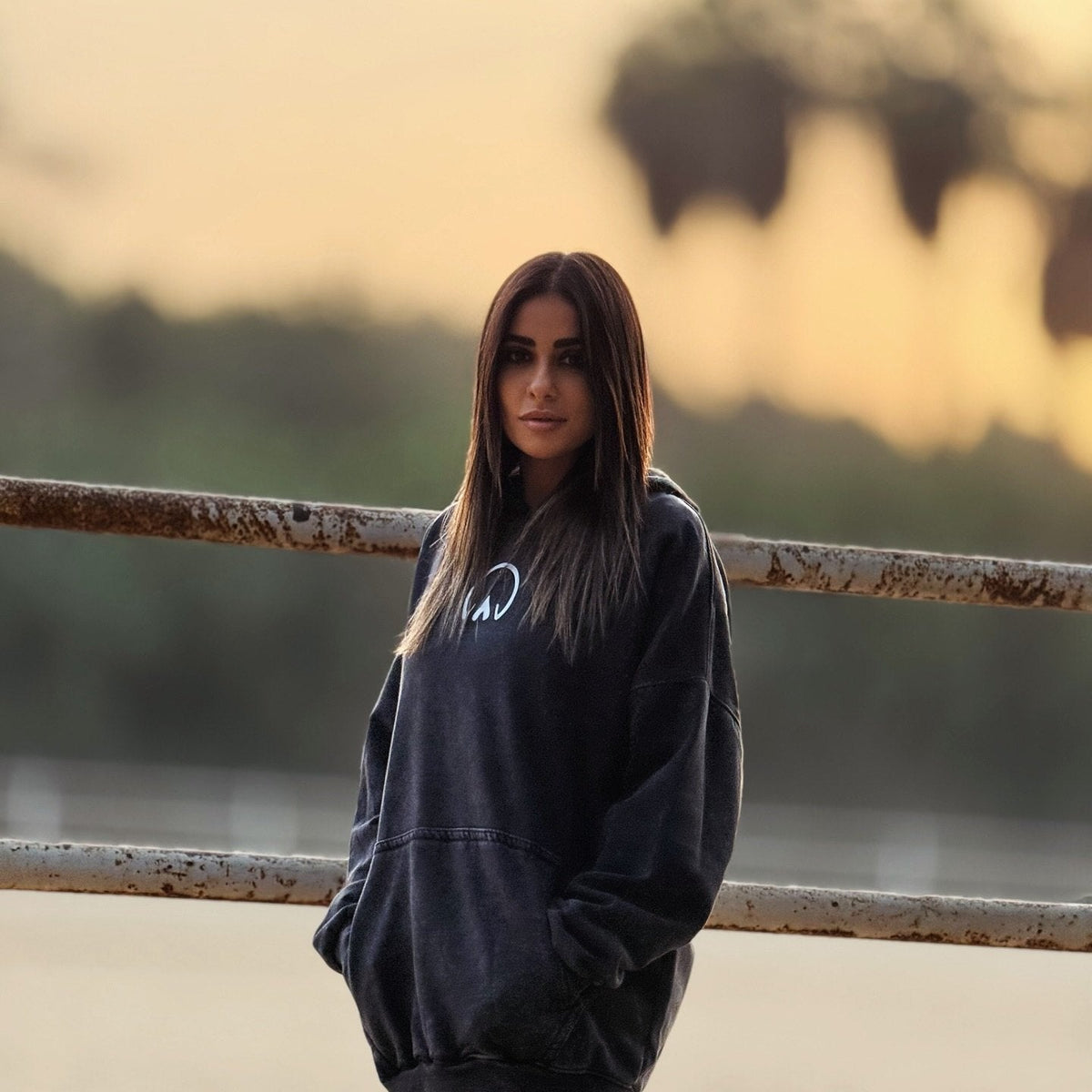 QADIM Asil washed hoodie in black, front view with small chest emblem — @marwaabuelezz | أصيل أسود من قدّام