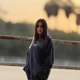 QADIM Asil washed hoodie in black, front view with small chest emblem — @marwaabuelezz | أصيل أسود من قدّام