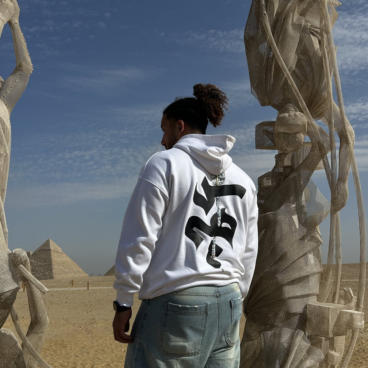 QADIM Sahm relaxed hoodie in white, back print, Giza desert | هودي سهم ريلاكس أبيض عند الأهرامات