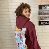 QADIM Tawabie relaxed hoodie in burgundy, vintage Egyptian stamps back print — @curlina.reviews | ضهر طوابع ريلاكس نبيتي