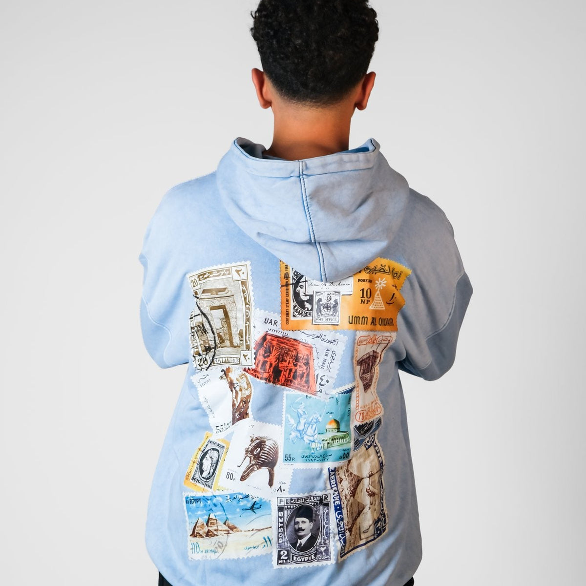 QADIM Tawabie washed hoodie in baby blue, vintage Egyptian stamps back print | ضهر هودي طوابع المغسول البيبي بلو