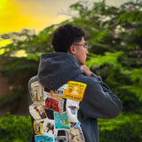 QADIM Tawabie washed hoodie in black, stamps back print, golden hour garden | هودي طوابع مغسول أسود وقت الغروب