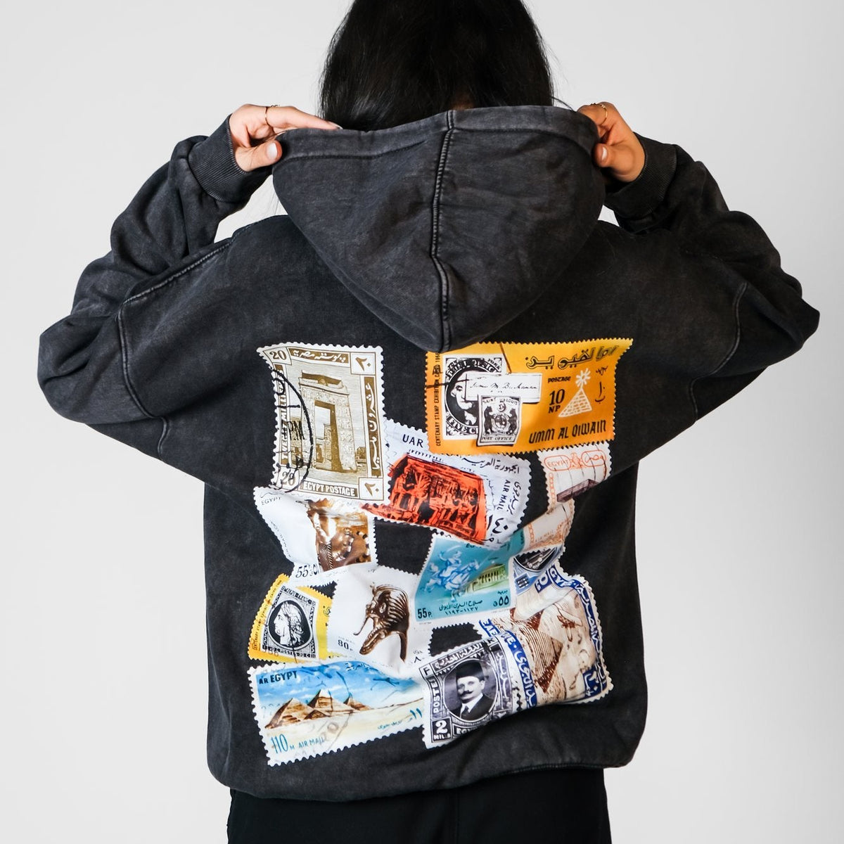 QADIM Tawabie washed hoodie in black, stamp collage back print | ضهر هودي طوابع المغسول الأسود
